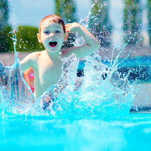 child playing in pool