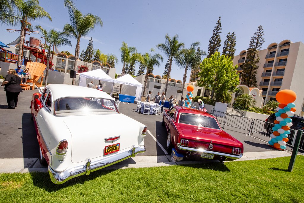 guests and retro cars at the retro unveiling event at Howard Johnson Anaheim