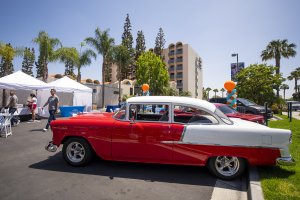 guests and retro cars at the retro unveiling event at Howard Johnson Anaheim