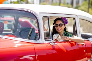 one of Howard Johnson Anaheim's retro friends poses in a retro car