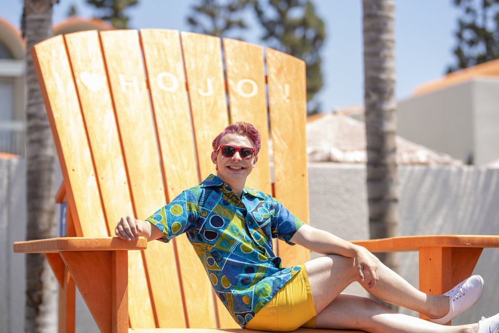 one of Howard Johnson Anaheim's retro friends poses on the large orange beach chair