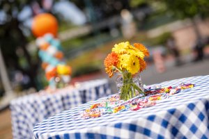 candy and flowers pictured on a table at the Howard Johnson Anaheim retro unveiling event