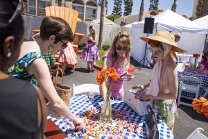 Howard Johnson Anaheim's retro friends choosing candy from a table