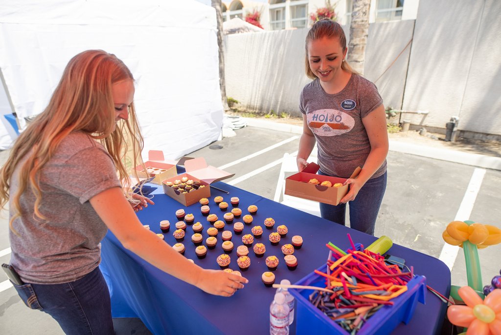 Howard Johnson staff sets up treats for event guests