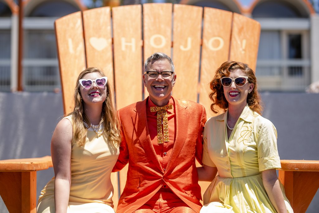 pop culture historian, Charles Phoenix, poses with HoJo Anaheim's retro friends