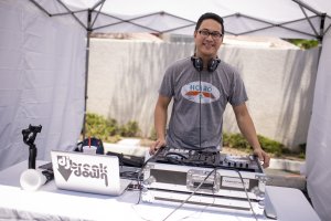 A dj spins tunes for guests at the Howard Johnson Anaheim retro unveiling event