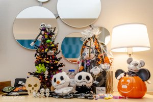 Halloween Disney decor and accessories pictured on a table