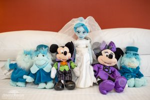 stuffed spooky Minnie and Mickey are pictured next to the Hitchhiking ghosts and bride from the Haunted Mansion dolls