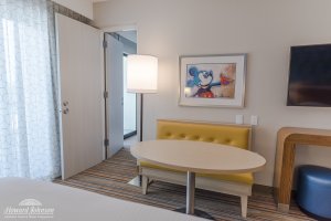 a Mickey Mouse picture inside a frame decorates a hotel room at Howard Johnson Anaheim