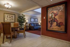a Pirates of the Caribbean themed poster in a hotel room dining suite