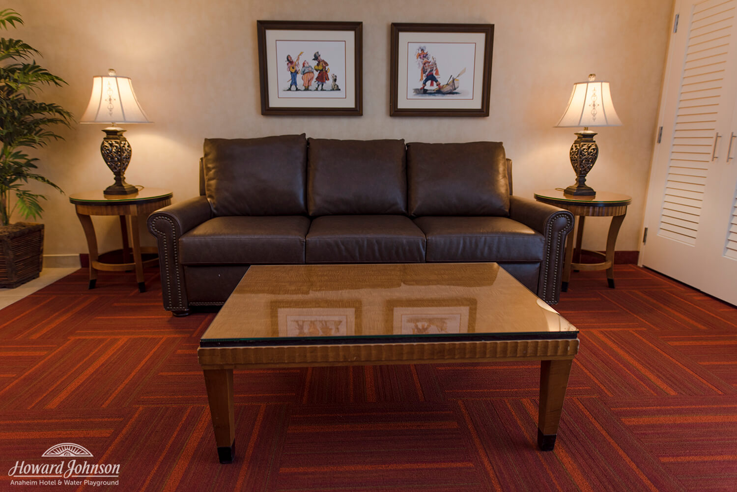 a hotel room living room at Howard Johnson Anaheim