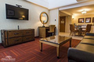 a hotel room living room at Howard Johnson Anaheim