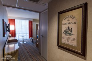 a Pirates of the Caribbean poster inside a hotel room