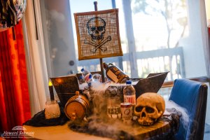 a pirate themed display features beverages on a table