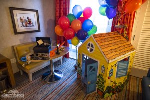 an UP movie themed hotel room features balloons and a cardboard house