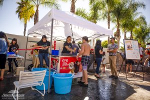 a booth with frozen ice cream treats and customers