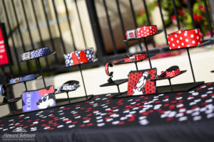 a plethora of Minnie Mouse accessories are displayed on a table with confetti