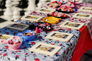 wooden photo frames and Minnie Mouse arts and crafts on a table
