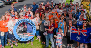 a group of people pose for a picture with a sign, identifying them as Mattercammers United