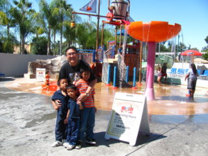 man and his three children outside Howard Johnson hotel water park