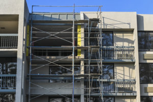 Building 2 undergoes a major transformation with scaffolding outside at Howard Johnson Anaheim