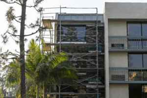 Building 2 undergoes a major transformation with scaffolding outside at Howard Johnson Anaheim