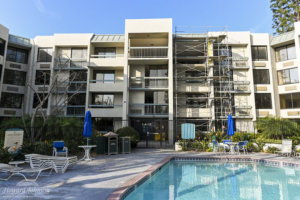 Building 2 undergoes a major transformation with scaffolding outside at Howard Johnson Anaheim.