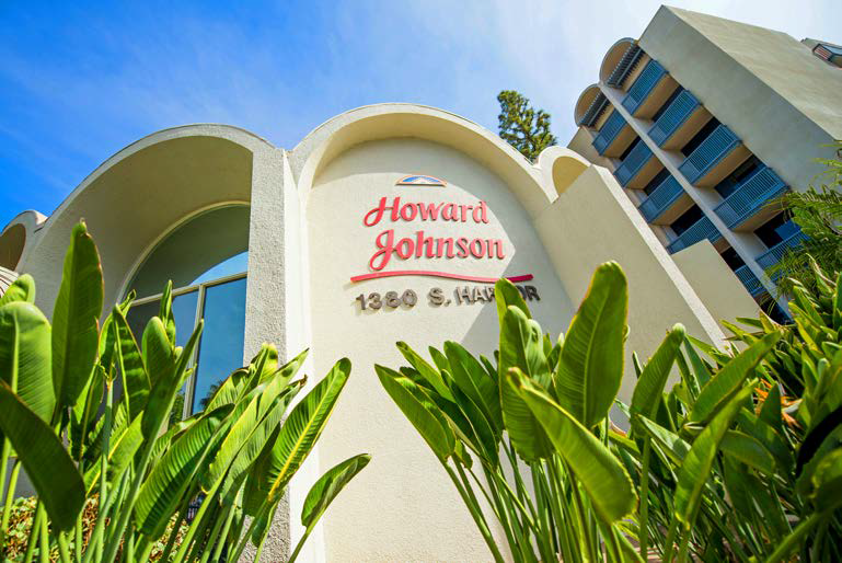 Make A Reservation Today And Check-In to Yesterday's Wondrous Tomorrow - Howard  Johnson by Wyndham Anaheim Hotel & Water Playground logo